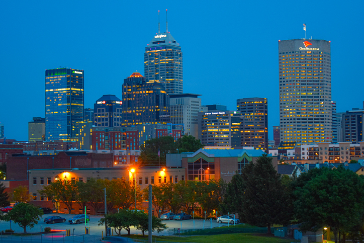 Illuminated Buildings Against Blue Sky