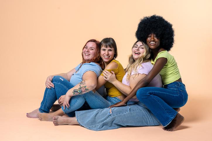 Body Positive and Acceptance, multiracial group of happy women with different body and ethnicity posing together to show the woman power and strength, curvy, plus size and skinny kind of female body concept