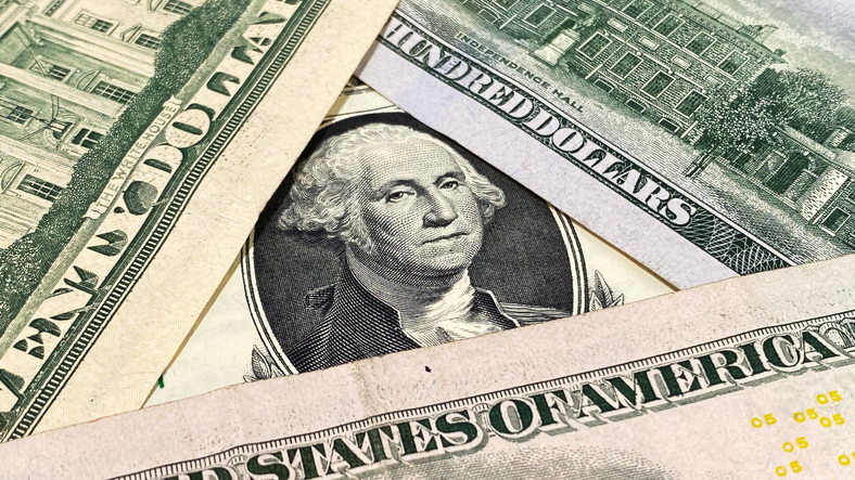 Close-up of part of a one dollar bill. Portrait of the country's first president, George Washington. American national currency. 1 dollar. Cash banknotes.