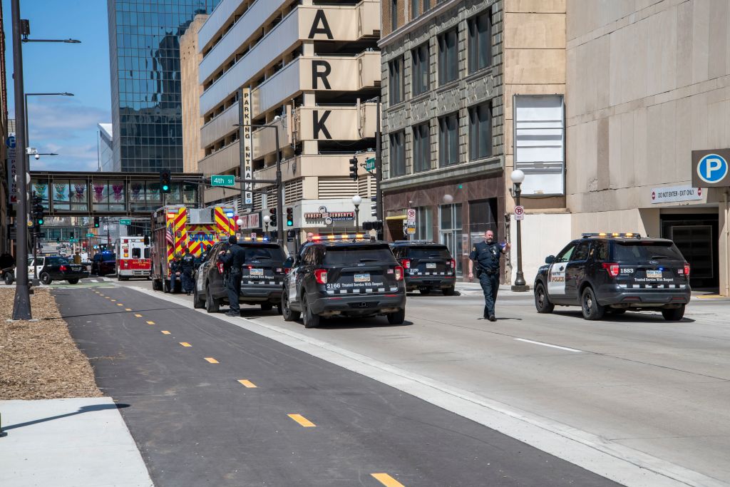 St. Paul, Minnesota, Police officer telling people to move back after woman attempting suicide pulls a gun out.