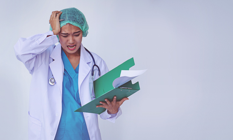 doctor headaches from working hard and stressful on white background.
