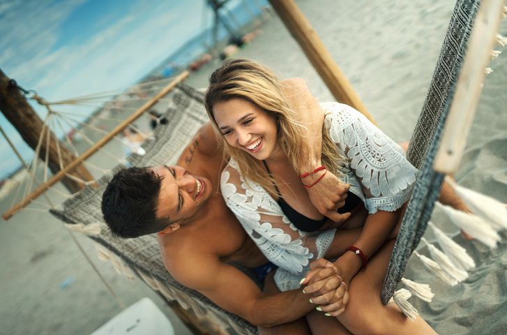 Couple relaxing at the beach.