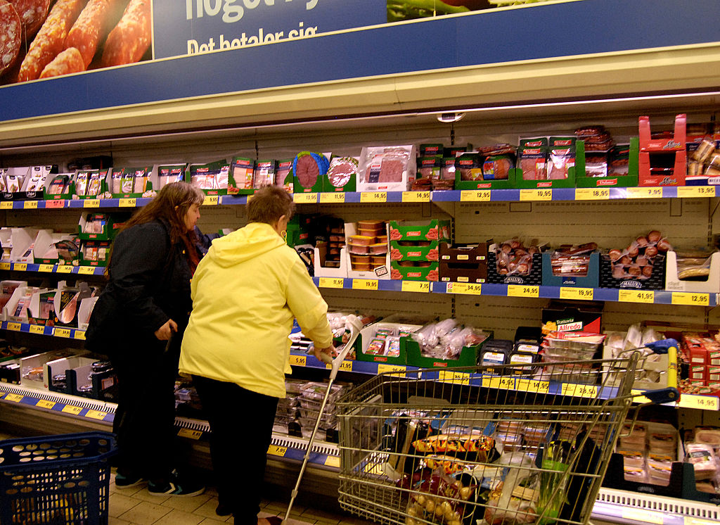 Consumers shopping in Lidl stor in Copenhagen,Denmark