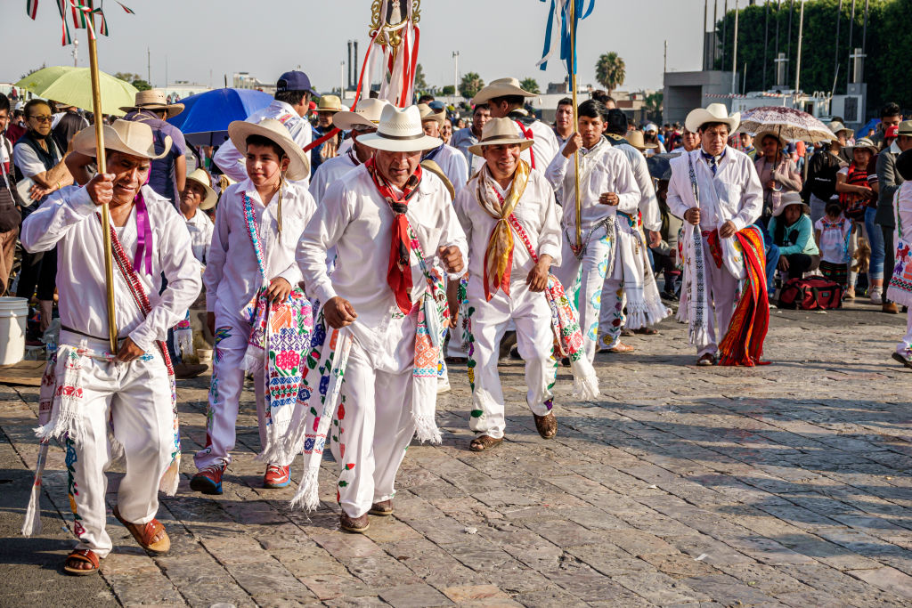 Mexico City, Mexico, Day of the Virgin of Guadalupe, Plaza Mariana Avenida Montevideo, indigenous Indians wearing traditional ceremonial dress, singing, chanting and dancing