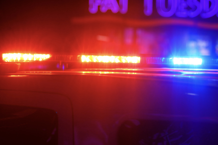 Police vehicles are parked at as police look for a person wanted