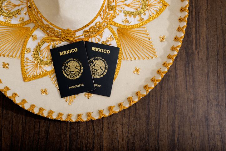 Mexican passport on charro hat. Mariachi hat and Mexican passport. Mexican citizenship concept.