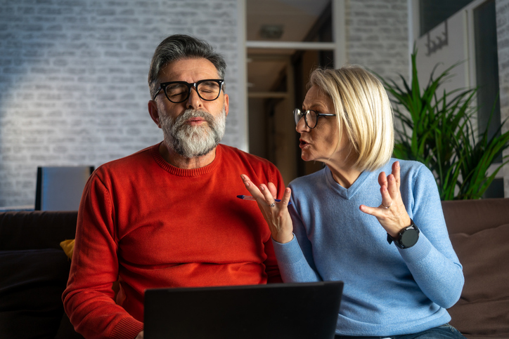 woman quarrels and yells at the loser's husband