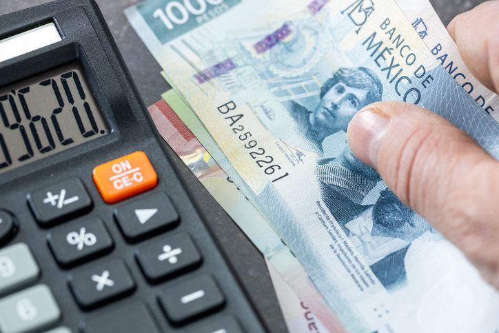 Mexican pesos banknotes, Calculator and money file, financial settlements, household budget, taxes, Mexico currency exchange rate, financial analysis, economic and business concept