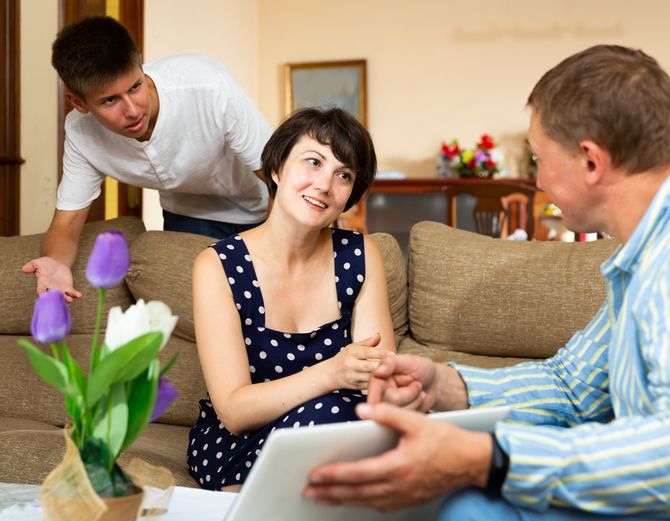 Adviser consulting woman at home