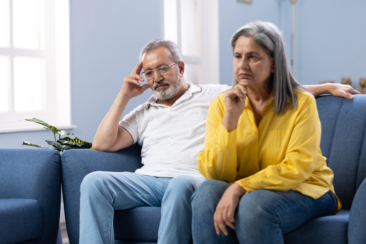 Sad senior woman after arguing with husband stock photo
