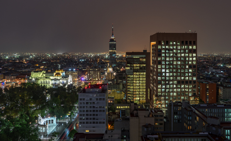 Torre Latinoamericana Amidst Buildings In City At Night