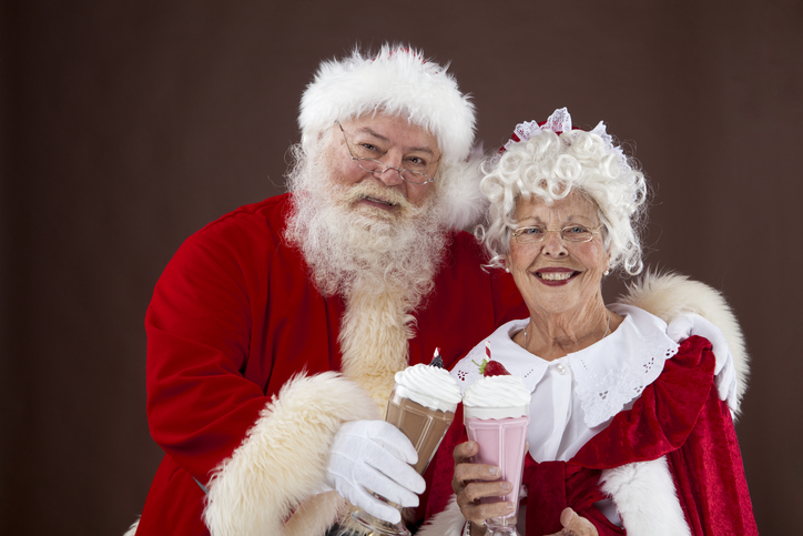 Santa and Mrs Claus drinking milk shakes