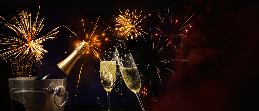Silvester 2025 New year New Year's Eve Party background banner panorama - Champagne bucket with champagne bottle, champagne glasses for toasting and firework fireworks pyrotechnics, dark black night sky