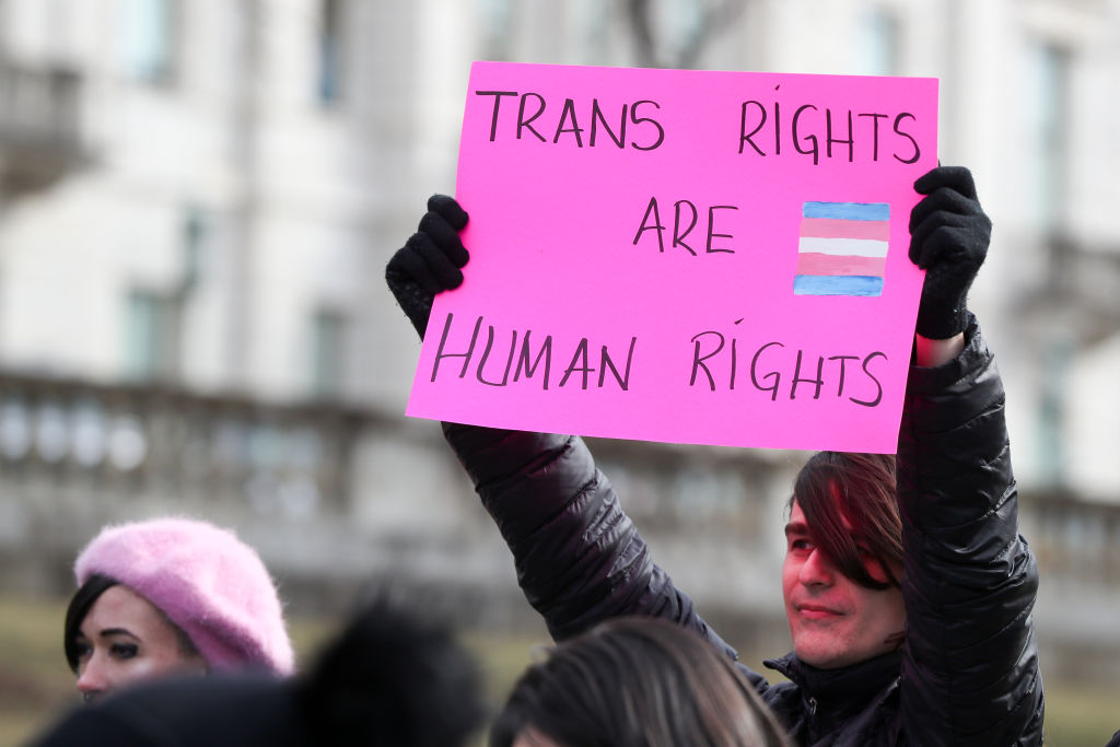 A protester holds a placard outside of the Pennsylvania...