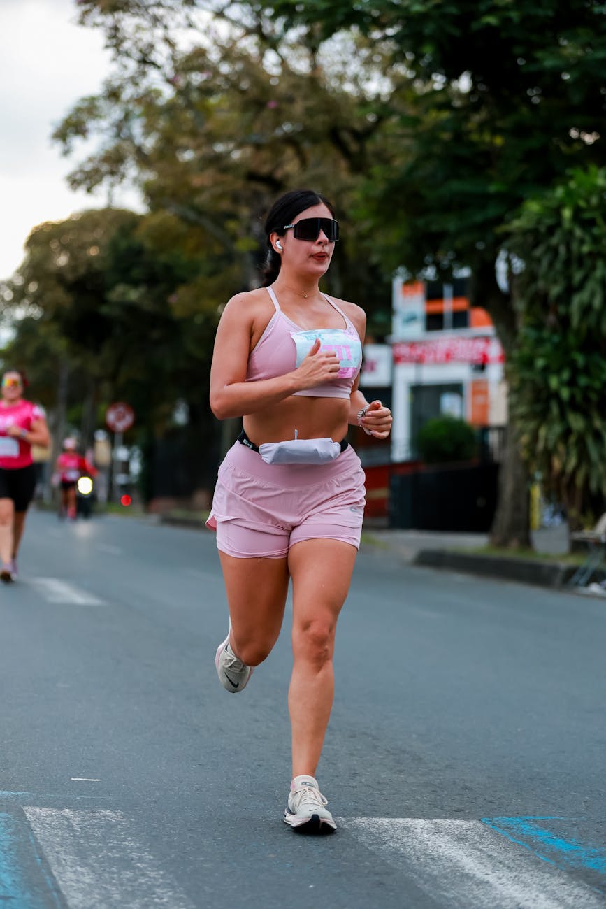 athletic woman running in urban marathon