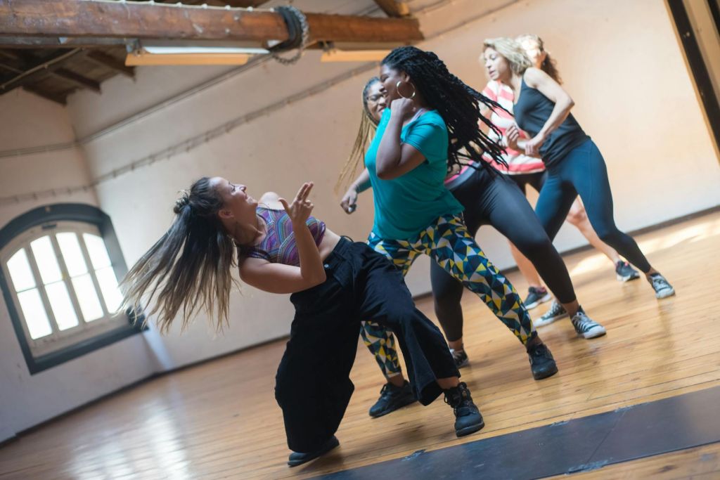 group of women dancing during a dance class