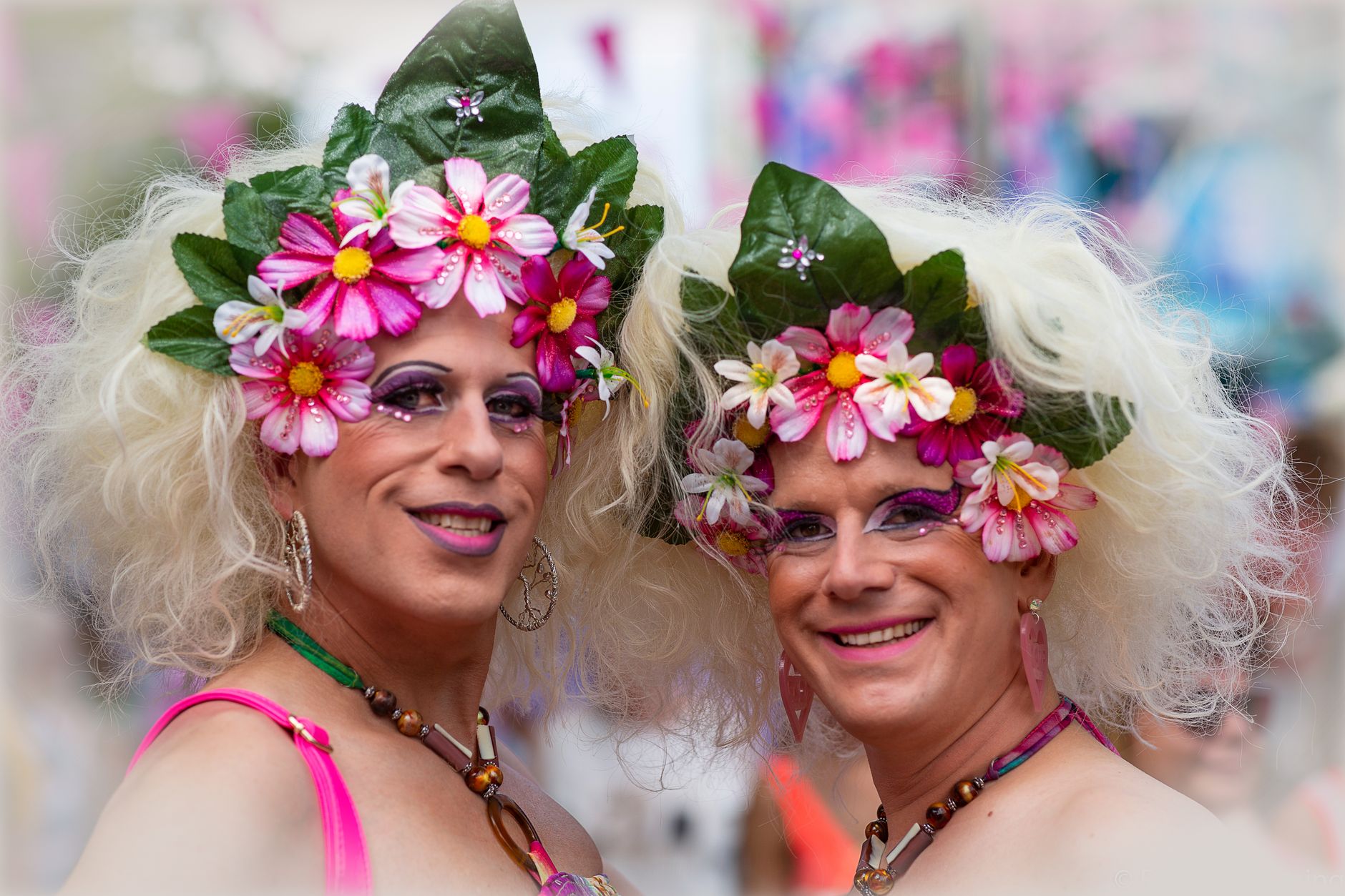 people wearing floral headbands and smiling