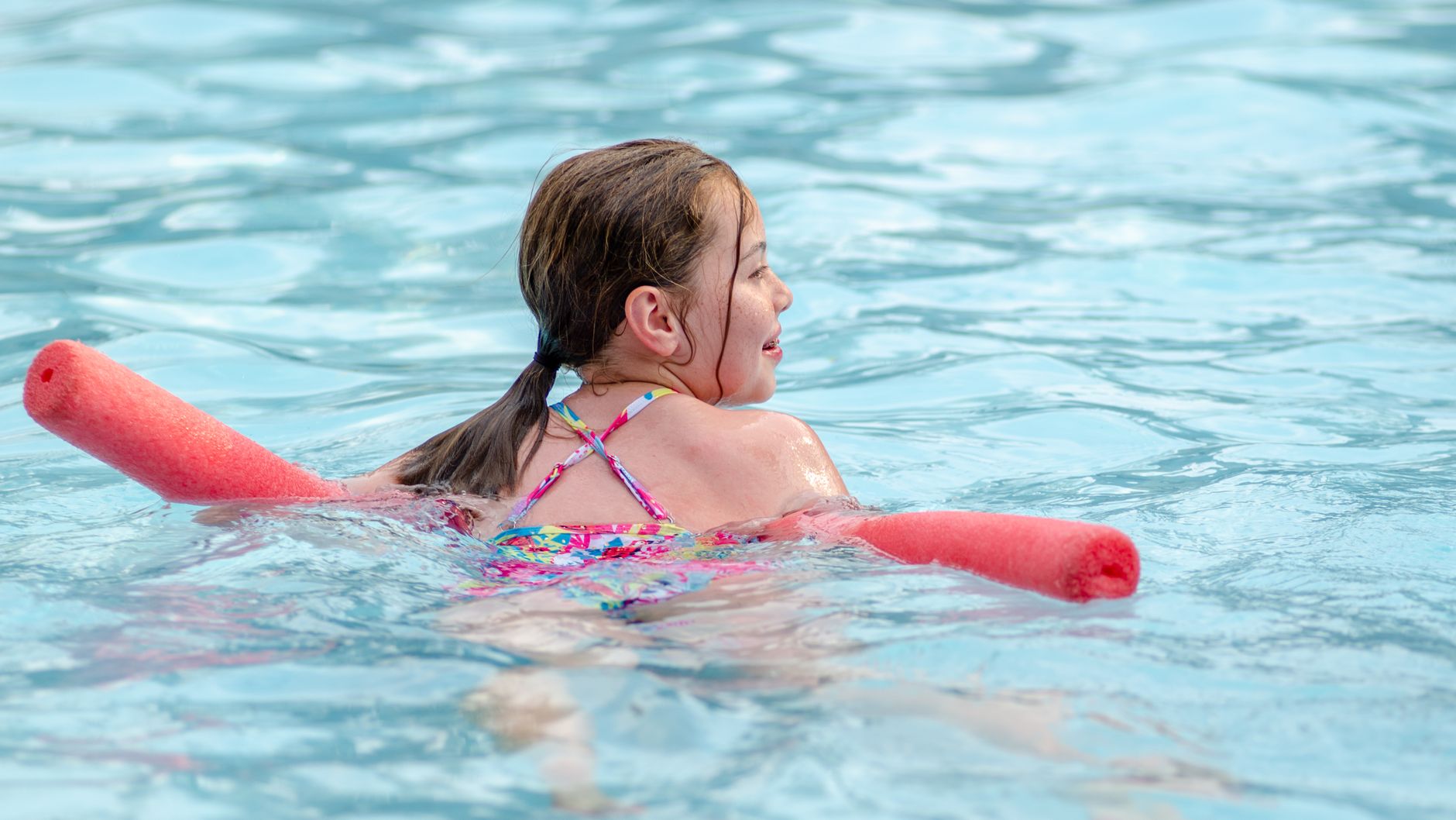 a girl swimming on the water